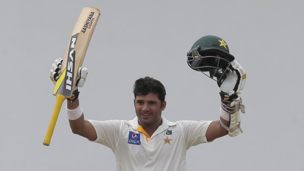 Pakistan's Azhar Ali stops to celebrate after reaching three figures.