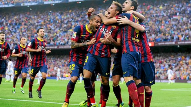 Neymar celebrates with his team-mates after scoring the opening goal for Barcelona.