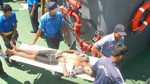 The Sri Lankan Navy rescues starving Burmese asylum seekers who were on their way to Indonesia and Australia. The survivors threw the bodies of their dead shipmates overboard.