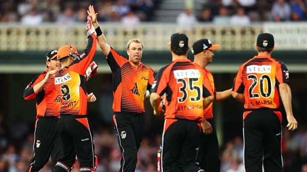 Michael Beer of the Scorchers celebrates after taking the wicket of Brad Haddin.