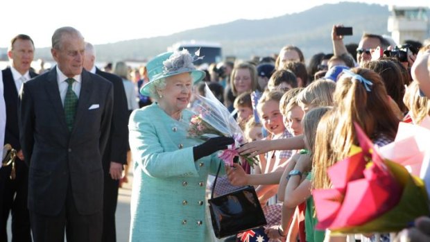 Her Majesty the Queen does a walkabout with his Royal Highness The Duke of Edinburgh, and meets with members of the public at her arrival in Canberra at Defence Establishment Fairbairn yesterday.