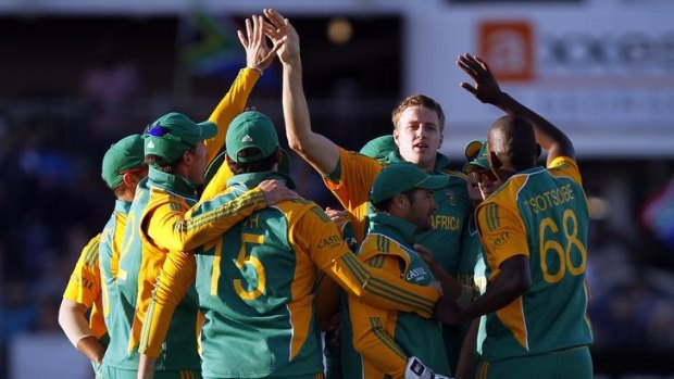 Morne Morkel of South Africa (second from right) celebrates the wicket of Australian captain Michael Clarke.