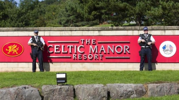 Armed police officers outside the Celtic Manor Resort, venue for the NATO summit in Wales.