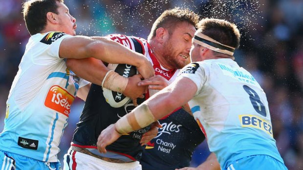 Tussle: Jared Waerea-Hargreaves and the Roosters found it hard going against the Titans.