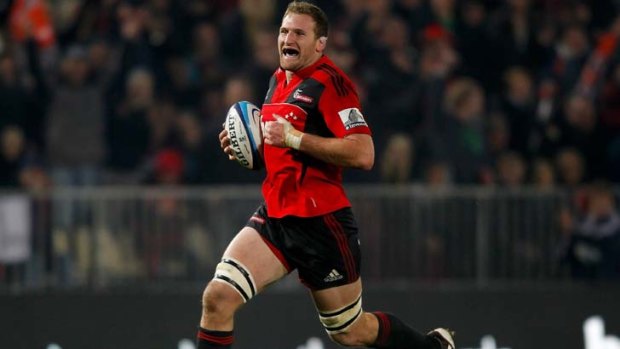 Breakthrough ... Kieran Read bursts through the Sharks defence and heads for the try line.