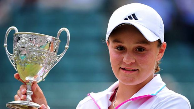 Ashleigh Barty poses with her trophy.