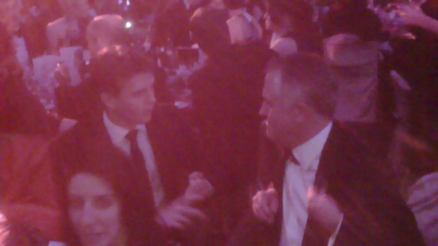 Andrew Charlton (left) and Malcolm Turnbull captured in a conversation on the Prime Minister's Blackberry at the 2009 MidWinter ball.