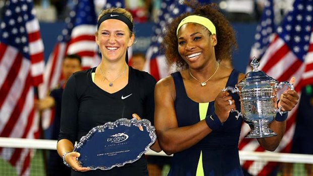 Serena Williams of the United States poses with the championship trophy next to Victoria Azarenka of Belarus.