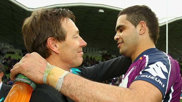 Storm coach Craig Bellamy and Greg Inglis embrace after Melbourne's last game for the season.