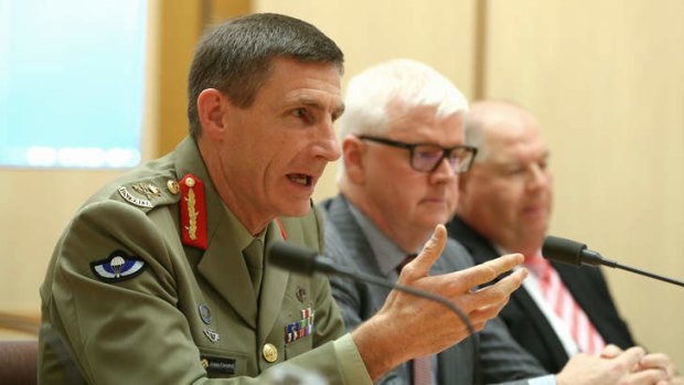 Operation Sovereign Borders chief Lieutenant-General Angus Campbell, doing the job of a minister.