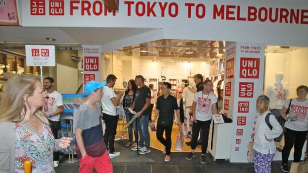 Shoppers queue to check out Uniqlo's pop-up shop in the city.