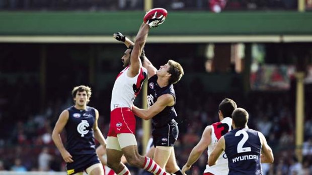 Goodes time ... Adam Goodes marks for the Swans against Carlton, Sydney's first Friday night opponent in eight years.
