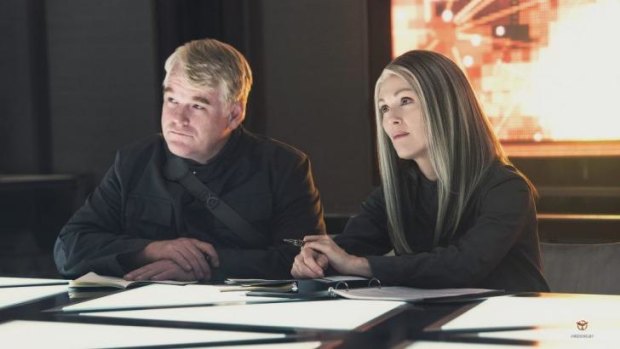 Philip Seymour Hoffman and Julianne Moore in <i>The Hunger Games: Mockingjay - Part 1</i>.