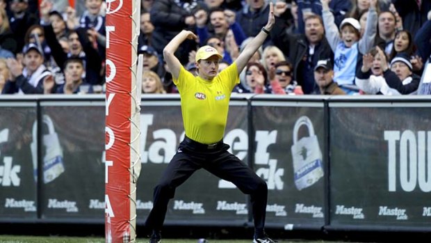On the spot: Goal umpires could do with help from post cameras in their judgments.