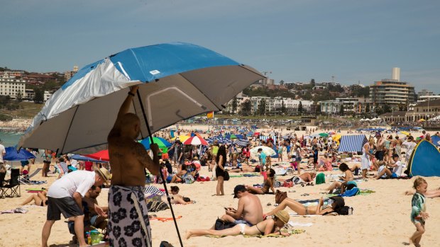 Late spring heat brought people to beaches in Melbourne while Sydney will likely post its fourth-warmest December. 