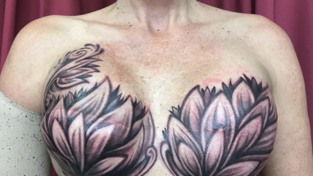 Feminine and empowered: Alyson Anderson sat for 3.5 hours for her breasts to be decorated with a design of lotus flowers and lilies.
