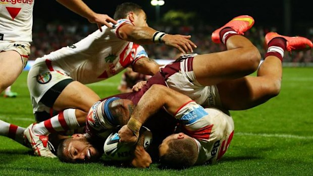 By Jorge: Manly Winger Jorge Taufua gets the ball down to score.