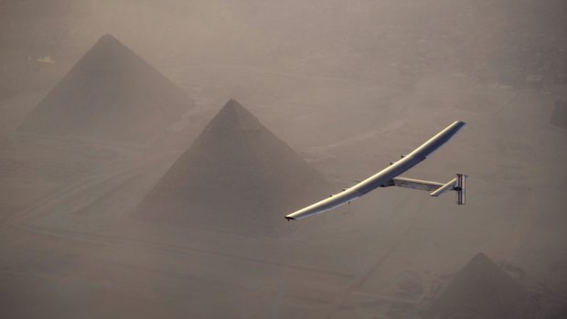 Solar Impulse 2 flies over the pyramids at Giza as it nears the end of its round-the-world trip. 