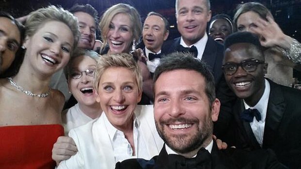 Ellen DeGeneres (centre) with actors front row from left, Jared Leto, Jennifer Lawrence, Meryl Streep, Ellen DeGeneres, Bradley Cooper, Peter Nyong'o Jr., and, second row, from left, Channing Tatum, Julia Roberts, Kevin Spacey, Brad Pitt, Lupita Nyong'o and Angelina Jolie as they pose for a 'selfie' portrait.