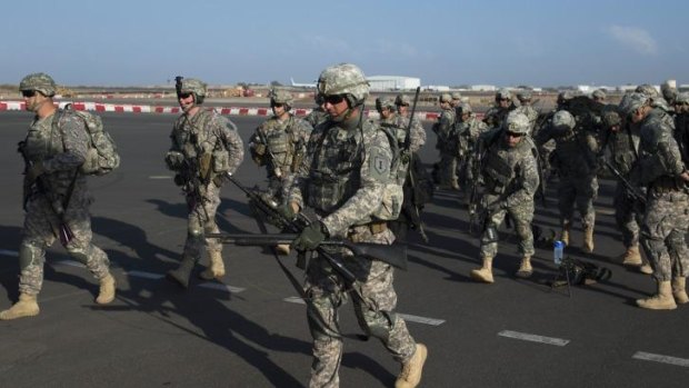 US Army soldiers of the East Africa Response Force in Djibouti prepare to load onto a US Air Force C-130 Hercules.
