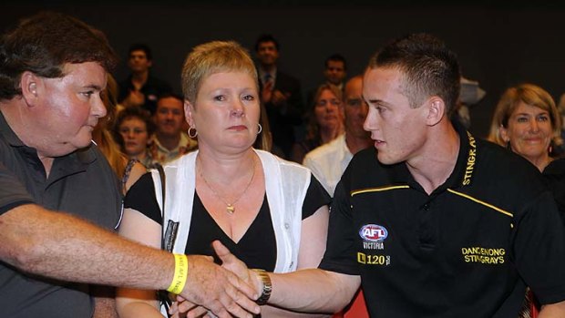 November 26 2009. Phil Scully congratulates son Tom after he is selected at number one in the national draft.