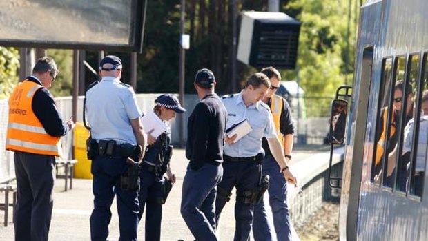 Police, paramedics and Metro Trains investigators at Tooronga Station in Melbourne where a one-year-old boy in a pram was struck by a train.
