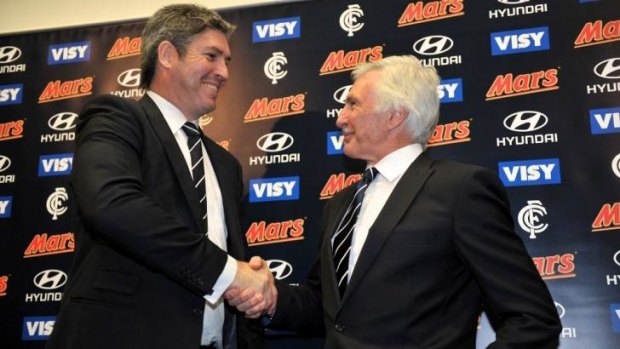 In happier times: Stephen Kernahan welcomes Mick Malthouse to the club back in September 2012.