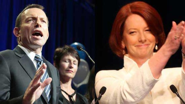 Julia Gillard last night accepts the applause of Labor Party faithful while Tony Abbott basks in the close result. <i>Pictures: Glen McCurtayne, Craig Sillitoe</i>