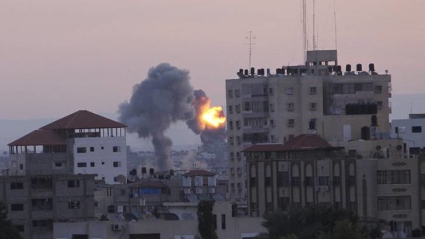 Smoke rises after Israeli air strikes in Gaza City on Friday.