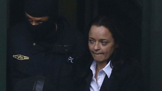 "Nazi moll": German special police forces escort handcuffed Beate Zschaepe into court.