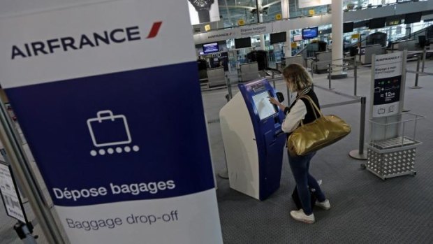 Nothing's coming: A passenger tries to check-in at Marseille airport.