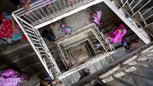 Bangladeshi workers leave for a lunch break at a garment factory in Dhaka.