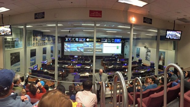 Mission Control in Johnson Space Center, with a live feed from the International Space Station.