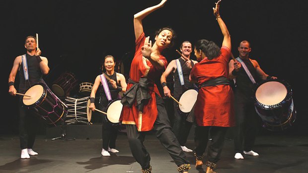 Earth and water: Performers in <i>Chi Udaka</i> move melodically to taiko drumming.