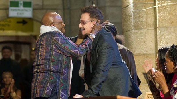 Happy birthday: Archbishop Desmond Tutu thanks U2's Bono.