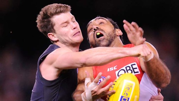 Sydney's Adam Goodes battles with Carlton's Bryce Gibbs.