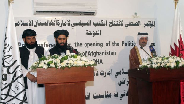 Qatari Assistant Minister for Foreign Affairs Ali bin Fahd al-Hajri (right) and the Taliban's office spokesman Mohammed Naim (centre) speak during a joint press conference at the opening ceremony of the new Taliban political office in Doha on June 18, 2013.