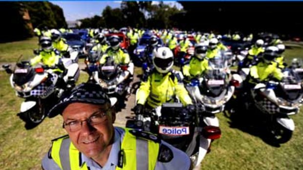 Speeding fine ... Ken Lay pictured at the head of his highway patrol troops in December.