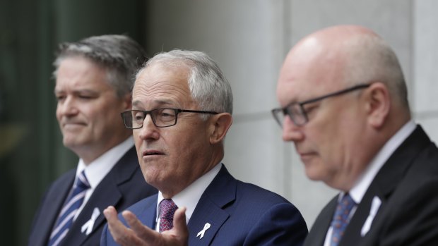 Prime Minister Malcolm Turnbull addresses the media during a joint press conference with Finance Minister Mathias Cormann and Attorney-General George Brandis on Tuesday. 