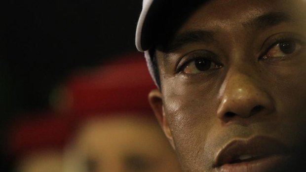 Williams "not a racist" ... Tiger Woods at this morning's  press conference.