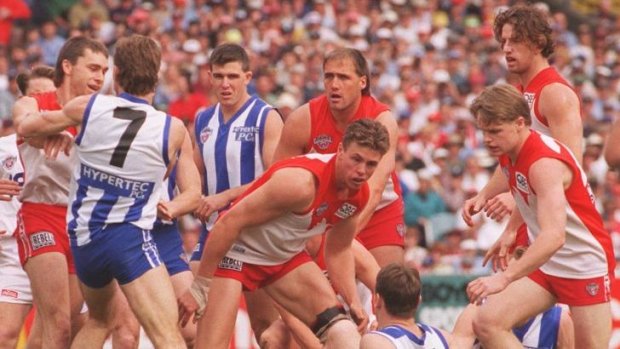 The Swans and Kangaroos battle out the 1996 grand final.