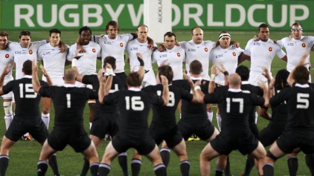 France players stand up to the All Blacks as they perform the haka.
