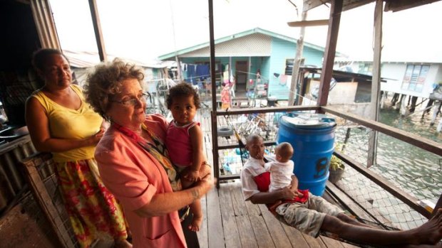 Dame Carol Kidu pictured with friends in the village of Pari, near the capital, Port Moresby.