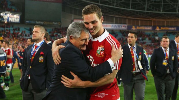 Best of British: Lions manager Andy Irvine celebrates with George North - one of 10 Welshmen in the Lions' starting side - after the tourists' victory in the third Test on Saturday.
