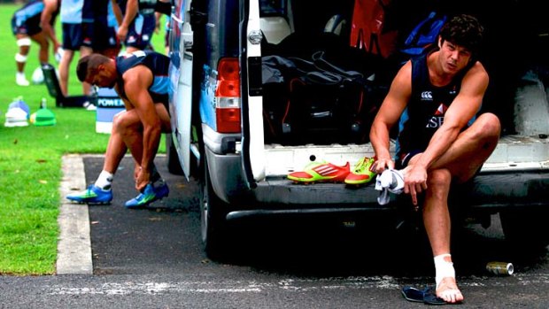 Boots and all: Tom Carter at Moore Park in the Tahs' first full session since the Brumbies loss.