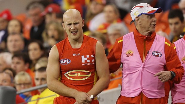 Sun's pain: Gary Ablett leaves the field in the last quarter against the Lions.
