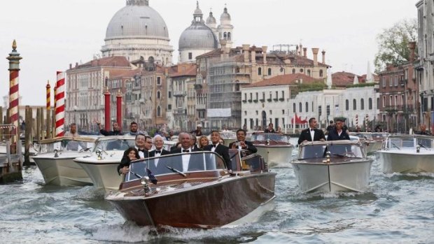 Actor George Clooney travels on a taxi boat to the venue of a gala dinner ahead of his official wedding in Venice.