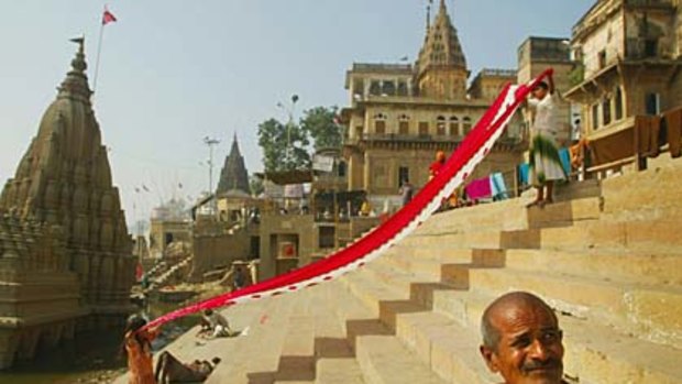 Laundry day ... women prepare to dry their saris on the ghats of the Ganges.