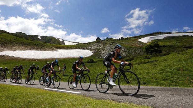 Britain's Peter Kennaugh, Australia's Richie Porte, and Britain's Christopher Froome ride during last year's Tour de France.