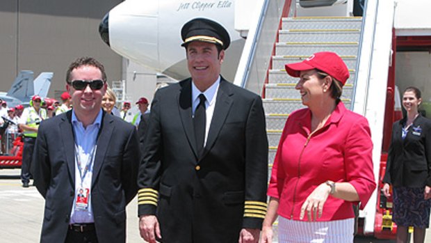 Qantas CEO Alan Joyce and Premier Anna Bligh welcome John Travolta to Brisbane.